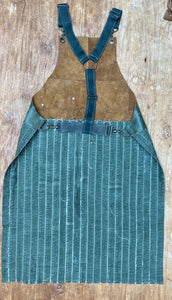 Up cycled green leather, green denim fabric. The fully recycled handmade apron.